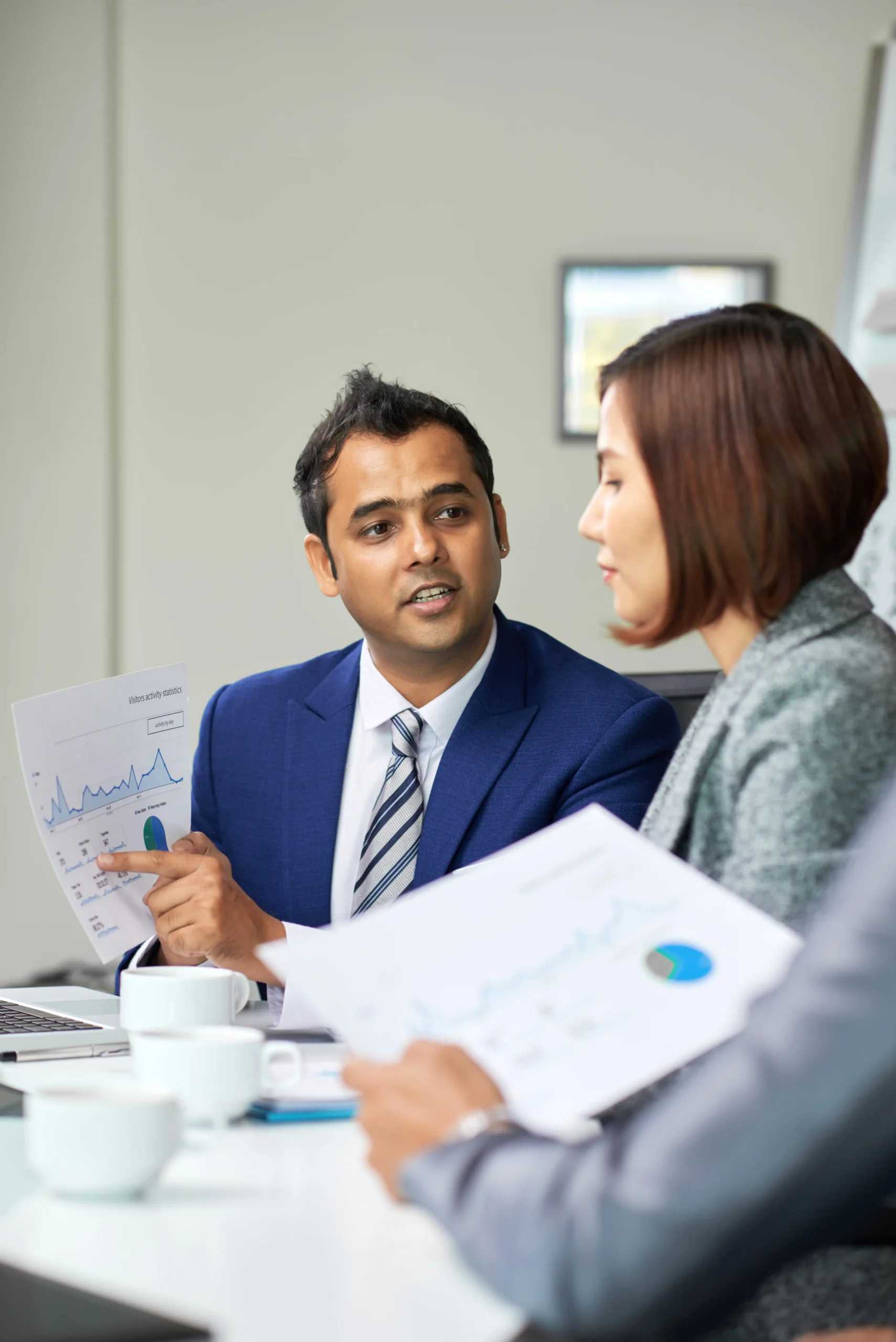 Business professional presenting financial report during office discussion